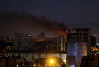 Fire and smoke rise in the city after Russian drone and missile strikes amid Russia's attack in Kyiv